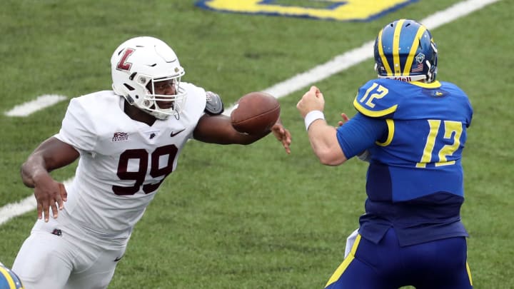 Lafayette defensive lineman Malik Hamm strips the ball from Delaware quarterback Pat Kehoe and keeps the Hens from finishing a drive deep in Leopard territory late in the second quarter at Delaware Stadium.

Ud V Lafayette