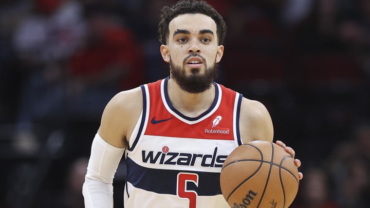 Mar 14, 2024; Houston, Texas, USA; Washington Wizards guard Tyus Jones (5) brings the ball up the court during the third quarter against the Houston Rockets at Toyota Center. Mandatory Credit: Troy Taormina-USA TODAY Sports