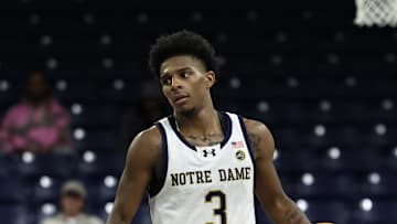 Notre Dame star Markus Burton brings the ball up the court