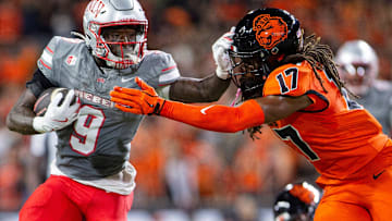 UNLV Rebels running back Jai'Den Thomas (9) stiff arms Oregon State Beavers defensive back Skyler Thomas (17) during an NCAA football game against UNLV at Reser Stadium on Saturday