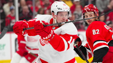 Mar 14, 2025; Raleigh, North Carolina, USA;  Detroit Red Wings right wing Vladimir Tarasenko (11) takes a shot against the Carolina Hurricanes during the second period at Lenovo Center. Mandatory Credit: James Guillory-Imagn Images