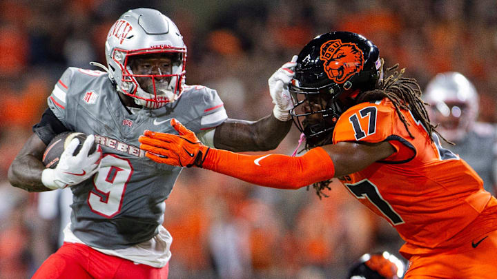 UNLV Rebels running back Jai'Den Thomas (9) stiff arms Oregon State Beavers defensive back Skyler Thomas (17) during an NCAA football game against UNLV at Reser Stadium on Saturday, Oct. 19, 2024, in Corvallis, Ore. UNLV Rebels running back Jai'Den Thomas (9) stiff arms Oregon State Beavers defensive back Skyler Thomas (17) during an NCAA football game against UNLV at Reser Stadium on Saturday, Oct. 19, 2024, in Corvallis, Ore.