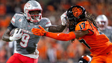 UNLV Rebels running back Jai'Den Thomas (9) stiff arms Oregon State Beavers defensive back Skyler Thomas (17) during an NCAA football game 