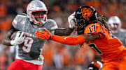 UNLV Rebels running back Jai'Den Thomas (9) stiff arms Oregon State Beavers defensive back Skyler Thomas (17) during an NCAA football game against UNLV at Reser Stadium 
