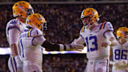Sep 28, 2024; Baton Rouge, Louisiana, USA;  LSU Tigers wide receiver Aaron Anderson (1) celebrates a touchdown with quarterback Garrett Nussmeier (13) against the South Alabama Jaguars during the first quarter at Tiger Stadium. Mandatory Credit: Stephen Lew-Imagn Images