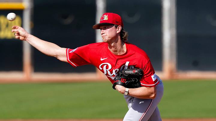 Cincinnati Reds pitcher Brady Singer (51) throws a pitch