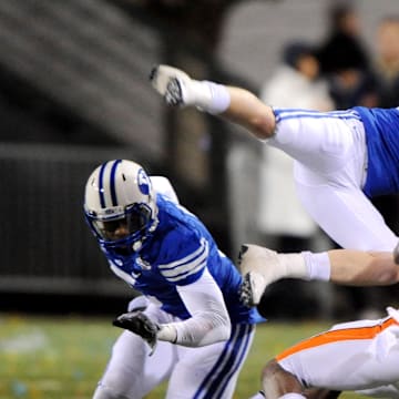 Dec 22, 2009; Las Vegas, NV, USA; BYU Cougars defensive back Scott Johnson (21), center, and Brian Logan (7) break up a pass intended for Oregon State Beavers receiver Markus Wheaton (2) in the fourth quarter of the 2009 Las Vegas Bowl at Sam Boyd Stadium. BYU defeated Oregon State 44-20. Mandatory Credit: Kirby Lee/Image of Sport-Imagn Images
