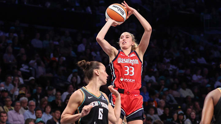 Aug 28, 2025; Brooklyn, New York, USA;  Washington Mystics guard Lucy Olsen (33) takes a three point shot in the first quarter against the New York Liberty at Barclays Center. Mandatory Credit: Wendell Cruz-Imagn Images