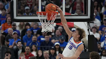 Nov 3, 2025; Las Vegas, NV, USA; Florida Gators forward Thomas Haugh (10) dunks the ball against the Arizona Wildcats during the second half of the Hall of Fame Series game at T-Mobile Arena. Mandatory Credit: Candice Ward-Imagn Images