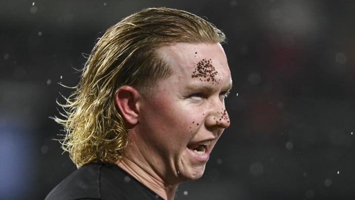 Jul 12, 2024; Baltimore, Maryland, USA;  Baltimore Oriolesoutfielder Heston Kjerstad (13) after stands on the field after being  hit by a pitch in the head during the ninth inning against the New York Yankees at Oriole Park at Camden Yards. 