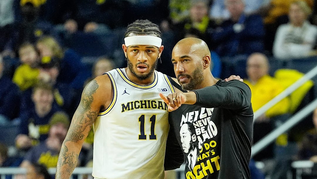Michigan guard Roddy Gayle Jr. (11) talks assistant coach Justin Joyner during the first half against Northwestern at Crisler Center in Ann Arbor on Sunday, Jan. 19, 2025.