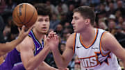 Oct 27, 2025; Salt Lake City, Utah, USA; Utah Jazz guard Walter Clayton Jr. (left) and Phoenix Suns guard Collin Gillespie (12) prepare for a jump ball during the second half at Delta Center. Mandatory Credit: Rob Gray-Imagn Images