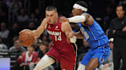 Nov 24, 2025; Miami, Florida, USA; Miami Heat guard Tyler Herro (14) drives to the basket as Dallas Mavericks guard Brandon Williams (10) defends during the first half at Kaseya Center. Mandatory Credit: Jim Rassol-Imagn Images
