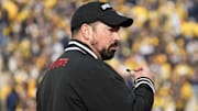 Nov 25, 2023; Ann Arbor, Michigan, USA; Ohio State Buckeyes head coach Ryan Day leads his team in warm-ups prior to the NCAA football game against the Michigan Wolverines at Michigan Stadium.