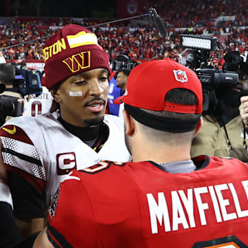 Washington Commanders quarterback Jayden Daniels greets Tampa Bay Buccaneers quarterback Baker Mayfield.