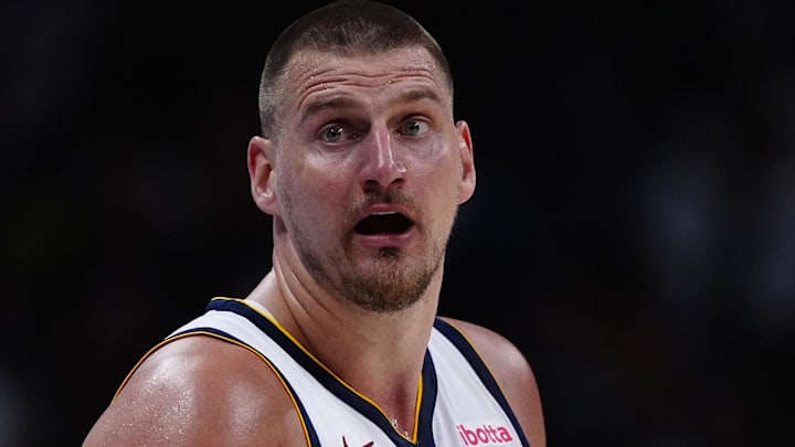 Apr 11, 2025; Denver, Colorado, USA; Denver Nuggets center Nikola Jokic (15) reacts in the fourth quarter against the Memphis Grizzlies at Ball Arena. Mandatory Credit: Ron Chenoy-Imagn Images