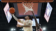 Mar 8, 2025; Austin, Texas, USA; Texas Longhorns guard Jordan Pope (0) drives to the basket against Oklahoma Sooners guard Duke Miles (15) during the second half at Moody Center. Mandatory Credit: Scott Wachter-Imagn Images