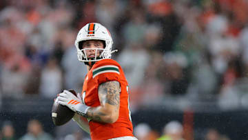 Sep 20, 2025; Miami Gardens, Florida, USA; Miami Hurricanes quarterback Carson Beck (11) looks for passing option against the Florida Gators during the first quarter at Hard Rock Stadium. Mandatory Credit: Sam Navarro-Imagn Images