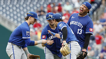 Sep 26, 2024; Washington, District of Columbia, USA; (L-R) Kansas City Royals shortstop Bobby Witt Jr. (7), Royals second baseman Michael Massey (19), Royals third baseman Adam Frazier (26), and Royals first baseman Salvador Perez (13) celebrate after their game against the Washington Nationals at Nationals Park. Mandatory Credit: Geoff Burke-Imagn Images