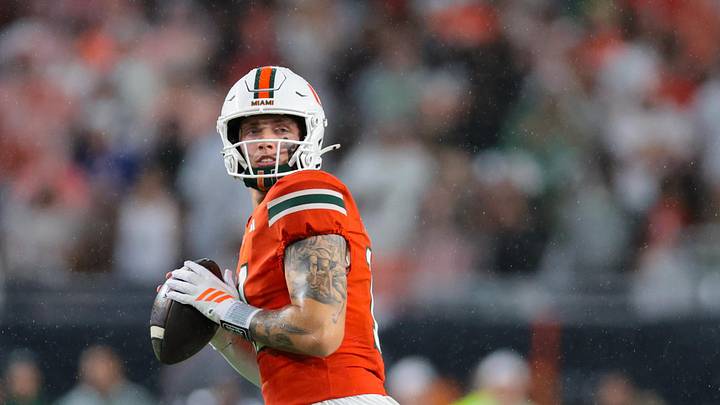 Sep 20, 2025; Miami Gardens, Florida, USA; Miami Hurricanes quarterback Carson Beck (11) looks for passing option against the Florida Gators during the first quarter at Hard Rock Stadium. Mandatory Credit: Sam Navarro-Imagn Images