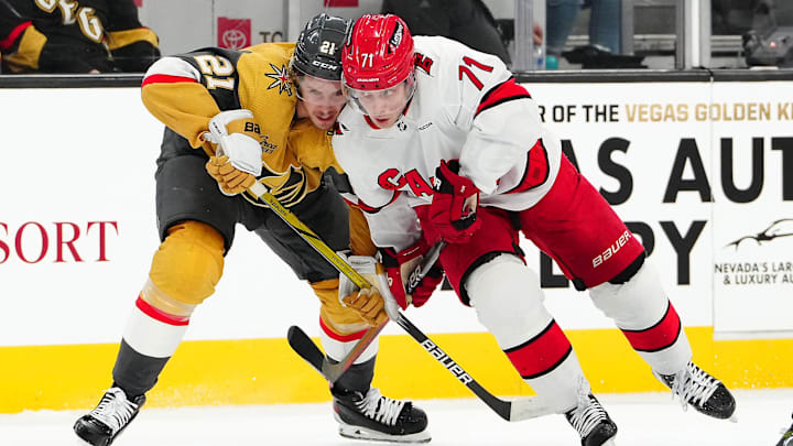 Feb 17, 2024; Las Vegas, Nevada, USA; Vegas Golden Knights center Brett Howden (21) skates against Carolina Hurricanes right wing Jesper Fast (71) during the first period at T-Mobile Arena. Mandatory Credit: Stephen R. Sylvanie-Imagn Images