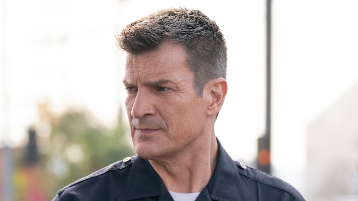 NATHAN FILLION looking serious from The Rookie