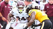 Mississippi State Bulldogs running back Fluff Bothwell (24) runs the ball against Southern Miss Golden Eagles safety Josh Battle (24) during the second quarter at M.M. Roberts Stadium in Hattiesburg, Miss., on Aug. 30, 2025.
