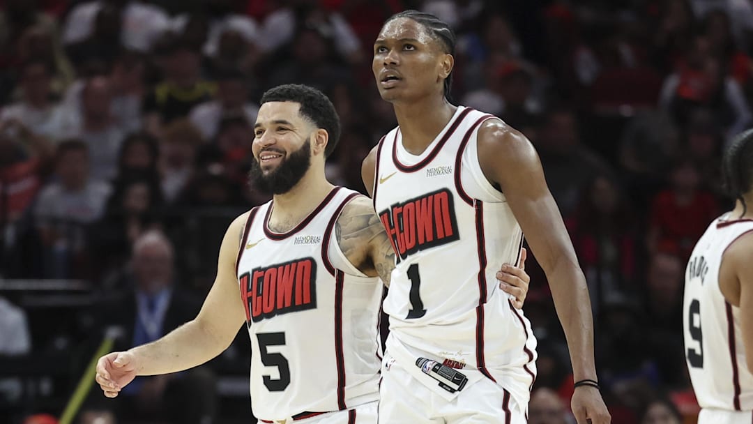 Mar 23, 2025; Houston, Texas, USA; Houston Rockets guard Fred VanVleet (5) and forward Amen Thompson (1) react after a play during the third quarter against the Denver Nuggets at Toyota Center. Mandatory Credit: Troy Taormina-Imagn Images