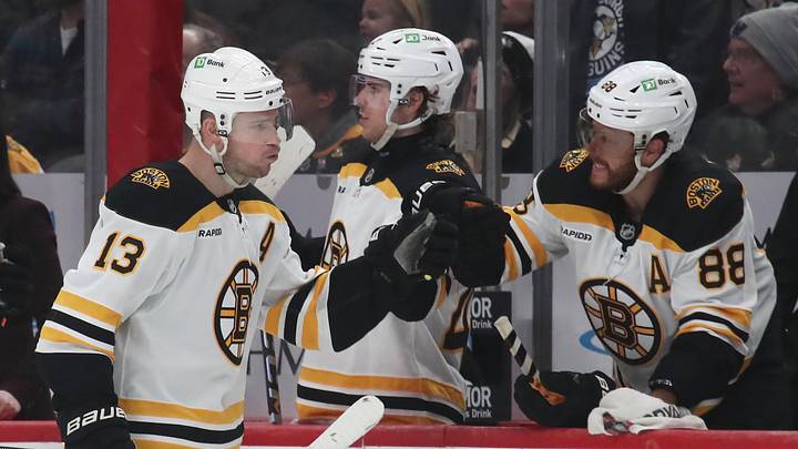 Mar 1, 2025; Pittsburgh, Pennsylvania, USA;  Boston Bruins right wing David Pastrnak (88) congratulates center Charlie Coyle (13) on an empty net goal against the Pittsburgh Penguins during the third period at PPG Paints Arena. Mandatory Credit: Charles LeClaire-Imagn Images