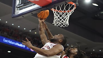 Feb 4, 2025; Auburn, Alabama, USA;  Oklahoma Sooners forward Glenn Taylor Jr. (35) goes up to block the shot of Auburn Tigers forward Chris Moore (5) during the second half at Neville Arena. Mandatory Credit: John Reed-Imagn Images