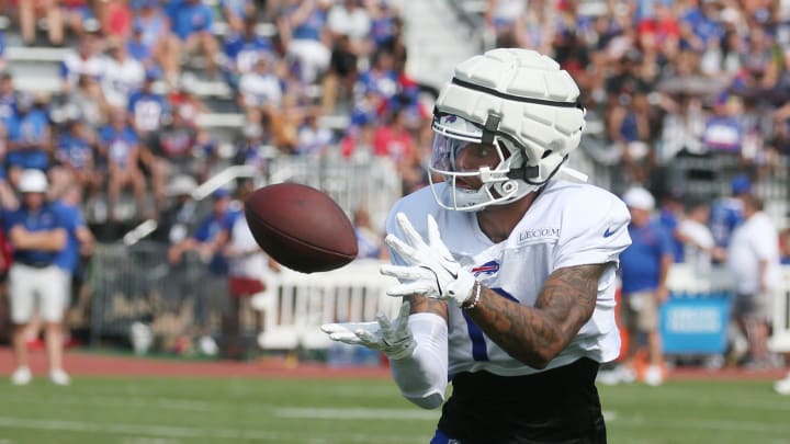 Bills wide receiver Keon Coleman pulls in a pass close to the sideline during route drills.