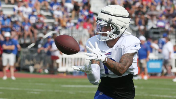 Bills wide receiver Keon Coleman pulls in a pass close to the sideline during route drills.