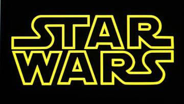 In this photo illustration, a Star Wars logo is seen on a...
