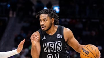 Mar 8, 2025; Charlotte, North Carolina, USA; Brooklyn Nets guard Cam Thomas (24) drives on Charlotte Hornets guard Nick Smith Jr. (8) during the second quarter at Spectrum Center. Mandatory Credit: Scott Kinser-Imagn Images