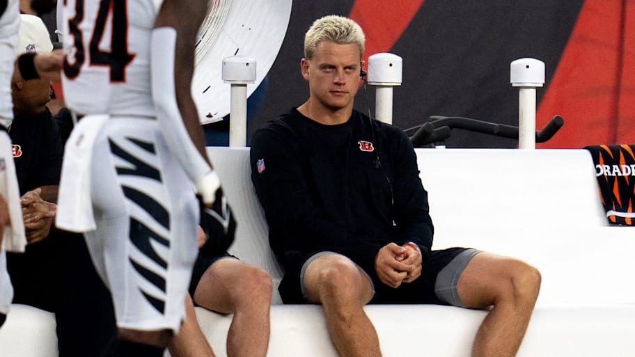 Cincinnati Bengals quarterback Joe Burrow (9) sits on the bench in the first quarter of the NFL preseason game between the Cincinnati Bengals and the Indianapolis Colts at Paycor Stadium in Cincinnati on Thursday, Aug. 22, 2024. | Albert Cesare/The Enquirer / USA TODAY NETWORK