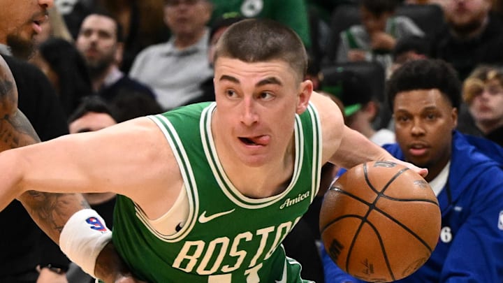 Apr 21, 2026; Boston, Massachusetts, USA; Boston Celtics guard Payton Pritchard (11) drives to the basket against Philadelphia 76ers guard Kelly Oubre Jr. (9) in the second half of a game two of the first round of the 2026 NBA Playoffs at TD Garden. Mandatory Credit: Brian Fluharty-Imagn Images