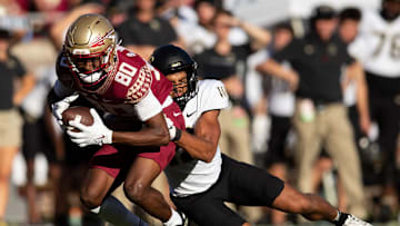 Florida State Seminoles wide receiver Ontaria Wilson (80) is tackled by a defender. The Florida State Seminoles lost to the Wake Forest Demon Deacons 31-21 Saturday, Oct. 1, 2022.

Fsu V Wake Forest Second805