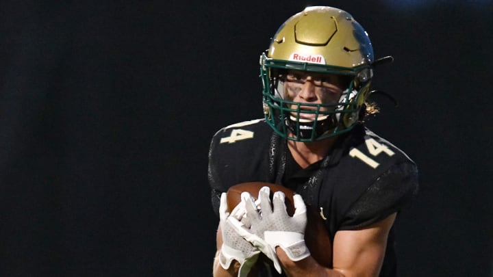 Nease Panthers Maddox Spencer (14) pulls in a pass in the end zone for his teams first touchdown of the game during first quarter action. The St. Augustine Yellow Jackets traveled to Nease High School's Panther Stadium for Friday night's Saint Johns County high school football rivalry game October 6, 2023.