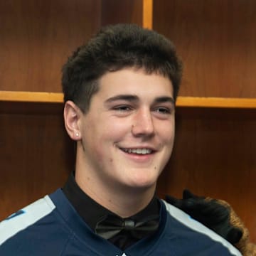 Division II - Class A 2024 Tennessee Titans Mr. Football Jared Curtis, Nashville Christian School, is photographed with T-Rac during the Titans Mr. Football Awards at Nissan Stadium in Nashville, Tenn., Tuesday, Dec. 10, 2024.