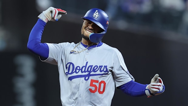 Dodgers outfielder Mookie Betts celebrates hitting a home run in 2024 NLCS