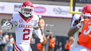 Arkansas Razorbacks wide receiver Andrew Armstrong runs behind a teammate's block after catching a pass against the Oklahoma State Cowboys at Boone Pickens Stadium in Stillwater, Okla.