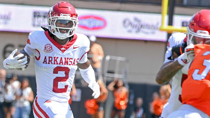 Arkansas Razorbacks wide receiver Andrew Armstrong runs behind a teammate's block after catching a pass against the Oklahoma State Cowboys at Boone Pickens Stadium in Stillwater, Okla.