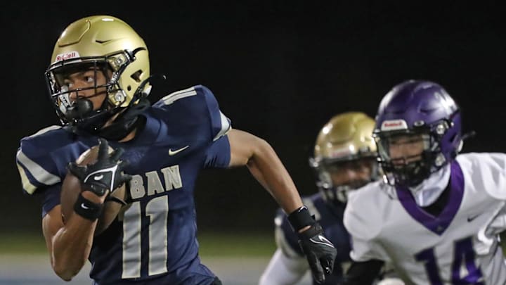 Hoban's Elbert Hill IV outruns Barberton's Trent DeWitt to score a touchdown during a Division II regional quarterfinal, Friday, Nov. 3, 2023. Hoban's Elbert Hill IV outruns Barberton's Trent DeWitt to score a touchdown during a Division II regional quarterfinal, Friday, Nov. 3, 2023.