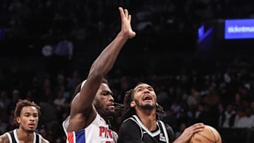 Nov 3, 2024; Brooklyn, New York, USA;  Brooklyn Nets forward Ziaire Williams (1) drives past Detroit Pistons center Isaiah Stewart (28) in the third quarter at Barclays Center. Mandatory Credit: Wendell Cruz-Imagn Images