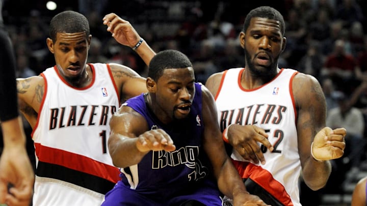 Oct. 6, 2009; Portland, OR, USA; Sacramento Kings guard Tyreke Evans (13) loses control of the ball as he drives to the basket on Portland Trailblazers forward LaMarcus Aldridge (12) and center Greg Oden (52) in the first quarter of the game at the Rose Garden. Mandatory Credit: Steve Dykes-Imagn Images