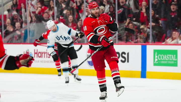 Feb 8, 2025; Raleigh, North Carolina, USA;  Carolina Hurricanes left wing Jordan Martinook (48) celebrates his empty net goal against the Utah Hockey Club during the third period at Lenovo Center. Mandatory Credit: James Guillory-Imagn Images