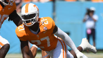 Sep 2, 2023; Nashville, Tennessee, USA; Virginia Cavaliers quarterback Tony Muskett (11) is sacked by Tennessee Volunteers defensive lineman James Pearce Jr. (27) during the first half at Nissan Stadium. Mandatory Credit: Christopher Hanewinckel-USA TODAY Sports