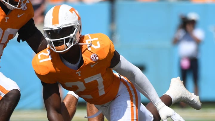 Sep 2, 2023; Nashville, Tennessee, USA; Virginia Cavaliers quarterback Tony Muskett (11) is sacked by Tennessee Volunteers defensive lineman James Pearce Jr. (27) during the first half at Nissan Stadium. Mandatory Credit: Christopher Hanewinckel-USA TODAY Sports