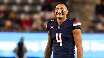 Arizona Wildcats wide receiver Tetairoa McMillan smiles at the scoreboard during a game against the Houston Cougars.