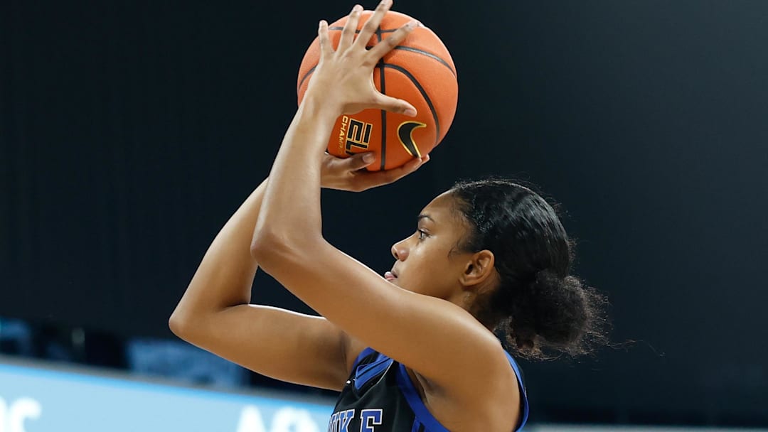 Nov 3, 2025; Paris, FRA;  Duke Blue Devils guard Riley Nelson (4) shoots a basket against Baylor Bears forward Kyla Abraham (12) during the first half at Adidas Arena. Mandatory Credit: Chris Jones-Imagn Images